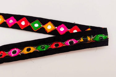 Wholesale Black Cotton Fabric Mirrored Trim With Embroidery In Yellow, Fuchsia Pink, Red & Green Threads